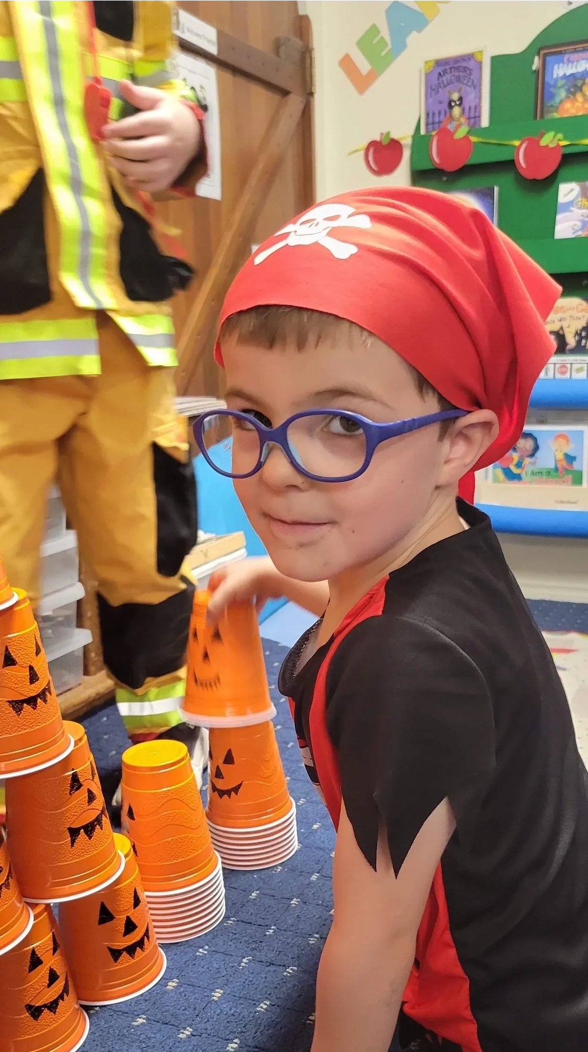 Child in pirate costume at Halloween classroom activity