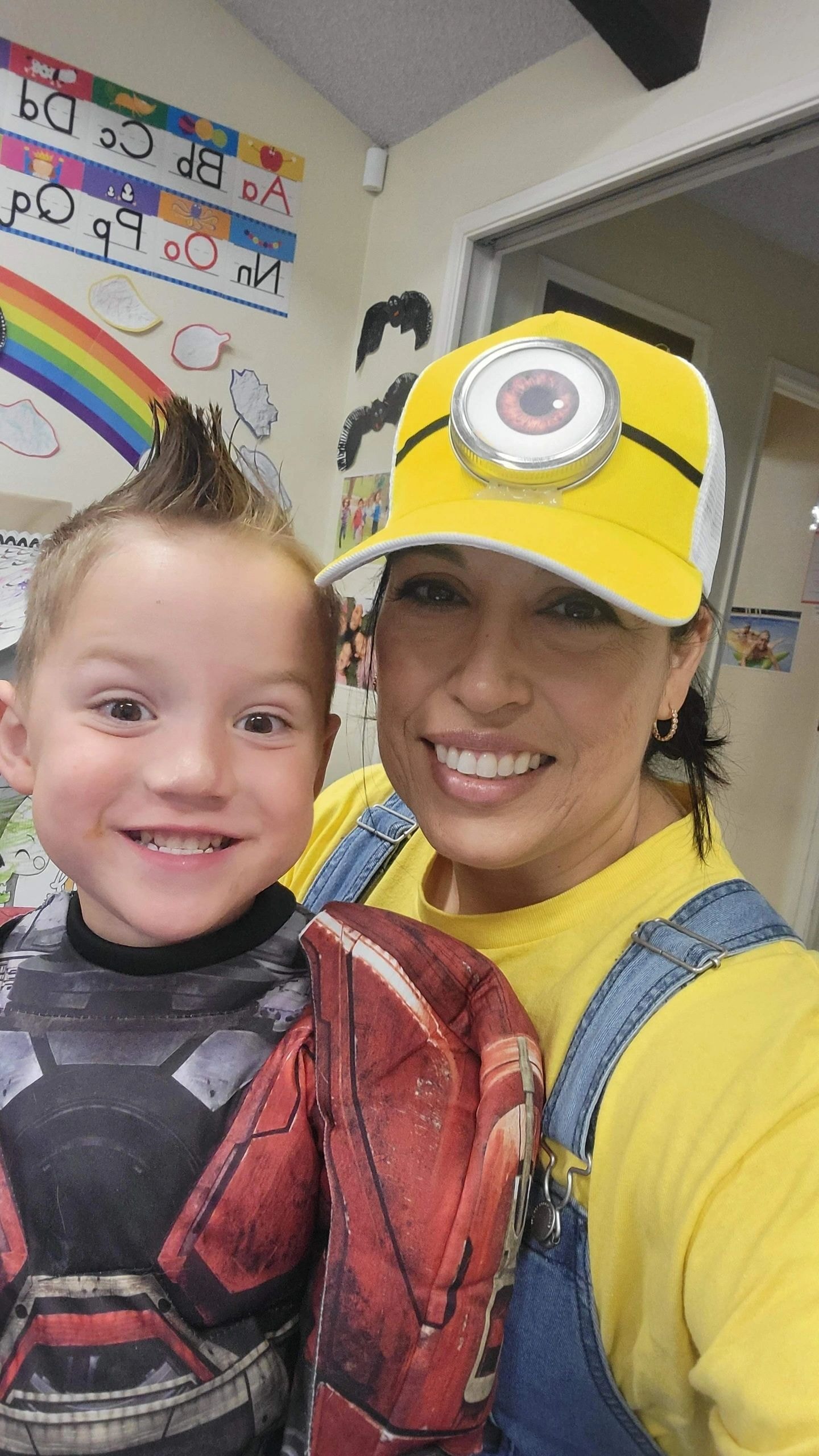 Teacher and child in Halloween costumes